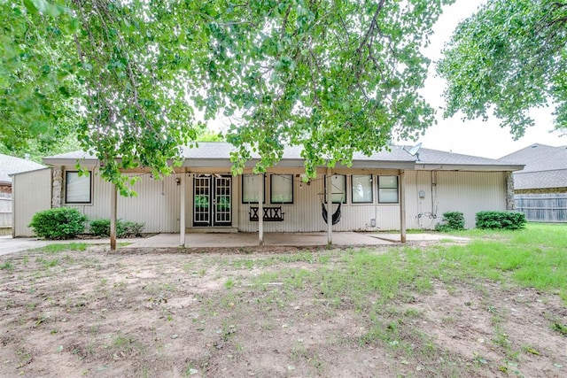 816 Woodbury Dr, Edmond, OK 73034 - back of property featuring a patio area