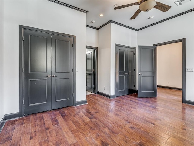 23 NE 3rd St, Oklahoma City, OK 73104 - unfurnished bedroom featuring ornamental molding, baseboards, wood finished floors, recessed lighting, and a ceiling fan