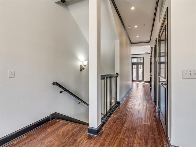 23 NE 3rd St, Oklahoma City, OK 73104 - hallway featuring an upstairs landing, wood finished floors, baseboards, and recessed lighting