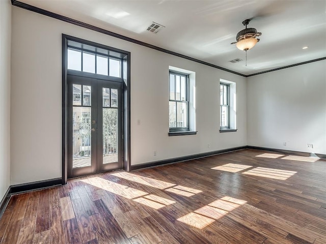 23 NE 3rd St, Oklahoma City, OK 73104 - unfurnished room featuring ornamental molding, french doors, hardwood / wood-style flooring, and baseboards