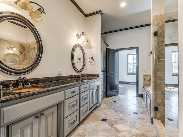23 NE 3rd St, Oklahoma City, OK 73104 - bathroom with double vanity, ornamental molding, a bathtub, tiled shower, and recessed lighting