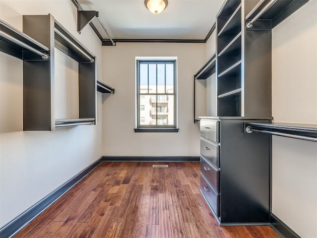 23 NE 3rd St, Oklahoma City, OK 73104 - walk in closet with dark wood-type flooring