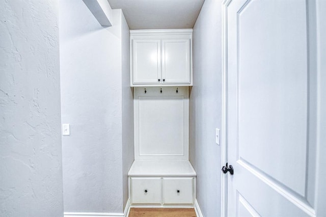 3232 Pagoda Pead Dr, Yukon, OK 73099 - mudroom with a textured wall and light wood-style floors