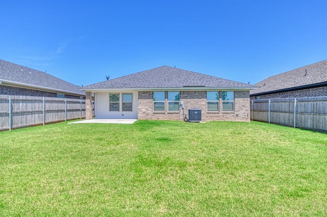 3232 Pagoda Pead Dr, Yukon, OK 73099 - rear view of property featuring a patio, a fenced backyard, brick siding, and roof with shingles