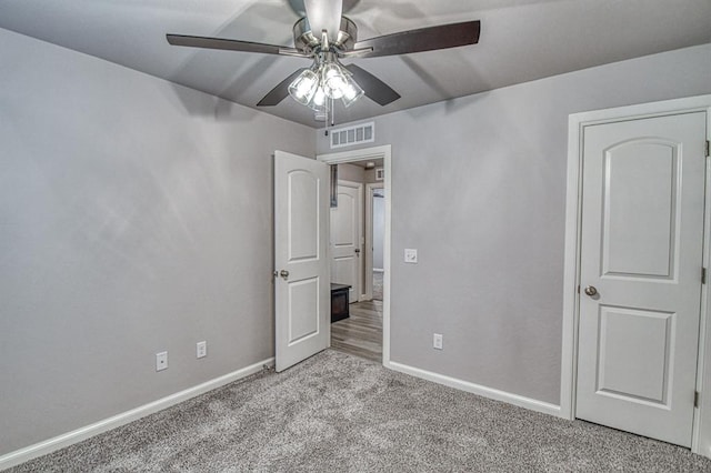 11100 NW 131st St, Yukon, OK 73099 - unfurnished bedroom with carpet flooring, baseboards, and ceiling fan