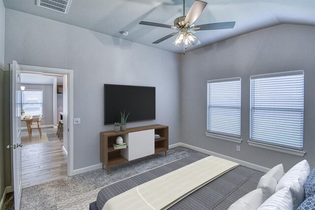 11100 NW 131st St, Yukon, OK 73099 - bedroom with carpet floors, lofted ceiling, and a ceiling fan