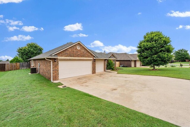 3401 First Capitol Cir, Guthrie, OK 73044 - single story home with brick siding, a garage, driveway, and central air condition unit
