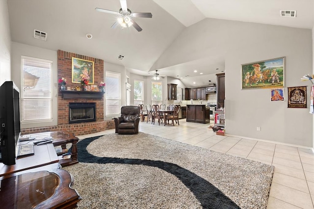 3401 First Capitol Cir, Guthrie, OK 73044 - living area featuring ceiling fan, lofted ceiling, light tile patterned floors, a fireplace, and baseboards