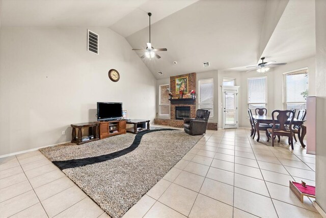 3401 First Capitol Cir, Guthrie, OK 73044 - living area with ceiling fan, light tile patterned flooring, a fireplace, and lofted ceiling