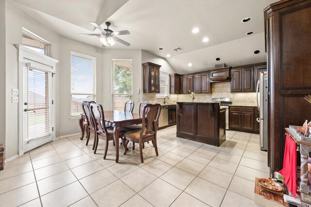 3401 First Capitol Cir, Guthrie, OK 73044 - dining space with a ceiling fan, light tile patterned floors, vaulted ceiling, recessed lighting, and baseboards