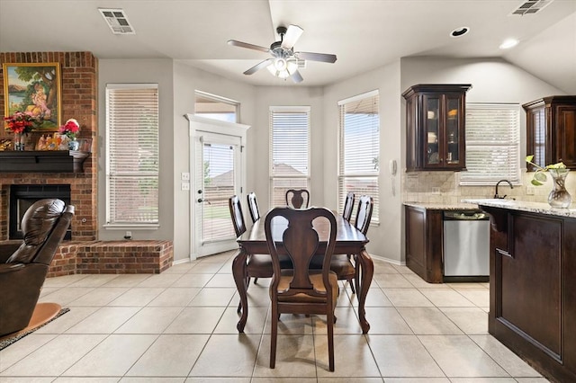 3401 First Capitol Cir, Guthrie, OK 73044 - dining area with ceiling fan, plenty of natural light, light tile patterned floors, a fireplace, and recessed lighting