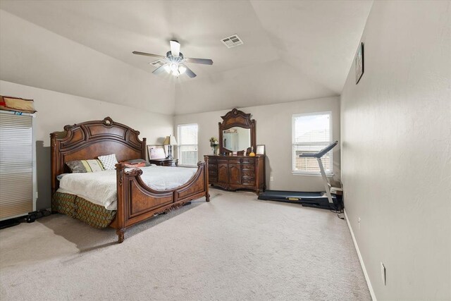 3401 First Capitol Cir, Guthrie, OK 73044 - carpeted bedroom featuring multiple windows, baseboards, vaulted ceiling, and ceiling fan