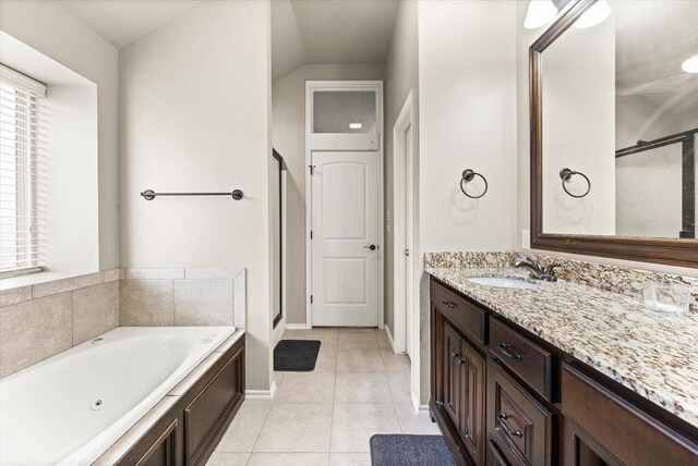 3401 First Capitol Cir, Guthrie, OK 73044 - bathroom with vanity, a tub with jets, a shower stall, tile patterned floors, and baseboards