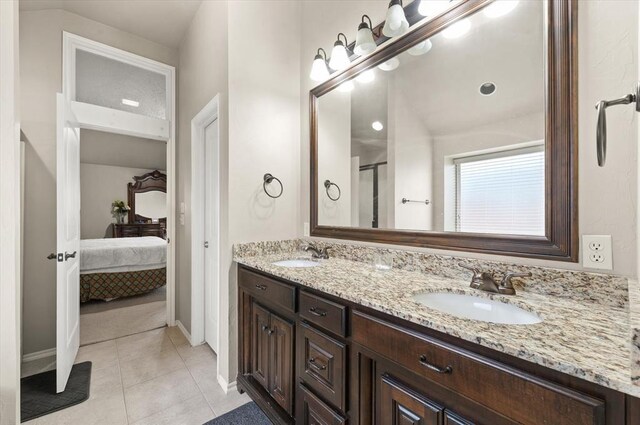 3401 First Capitol Cir, Guthrie, OK 73044 - ensuite bathroom with double vanity, tile patterned flooring, baseboards, and a shower