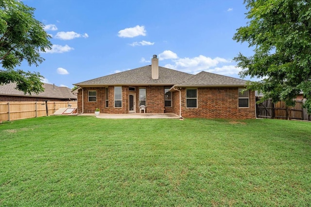 3401 First Capitol Cir, Guthrie, OK 73044 - rear view of property with a patio, brick siding, and a chimney