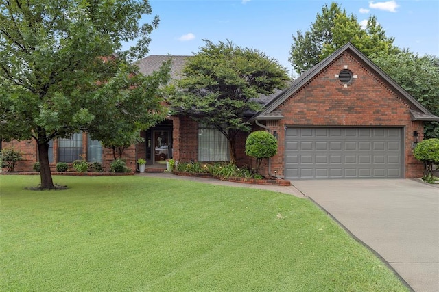 4001 Innsbrook Ct, Norman, OK 73072 - view of front facade with driveway, a front lawn, brick siding, and a garage