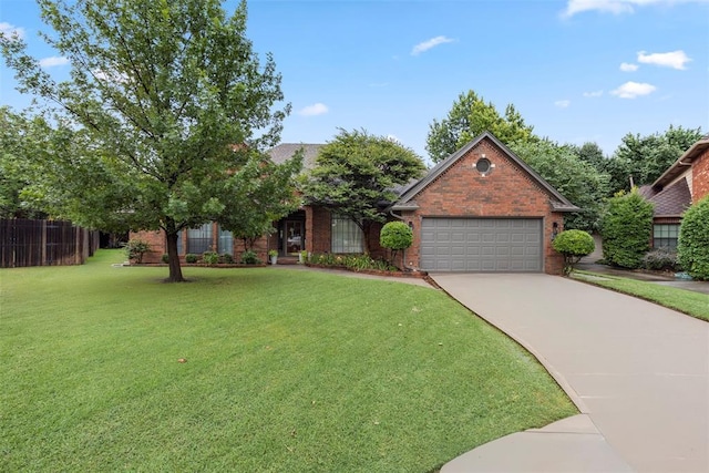 4001 Innsbrook Ct, Norman, OK 73072 - view of front of house with a garage, brick siding, and driveway