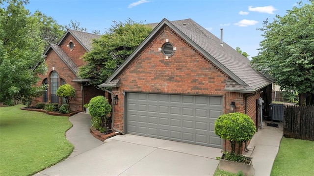 4001 Innsbrook Ct, Norman, OK 73072 - view of front facade with brick siding, a shingled roof, and driveway