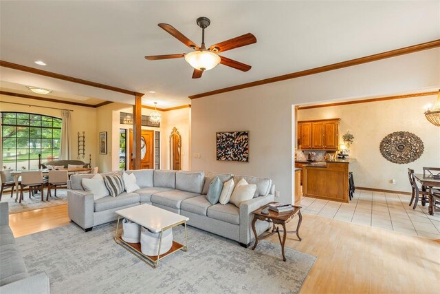 4001 Innsbrook Ct, Norman, OK 73072 - living area featuring ornamental molding, a ceiling fan, light wood-style floors, and recessed lighting