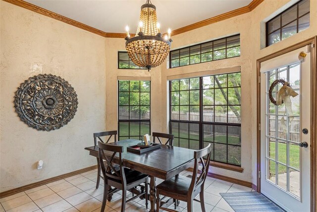 4001 Innsbrook Ct, Norman, OK 73072 - dining area featuring a chandelier, light tile patterned flooring, ornamental molding, and a textured wall