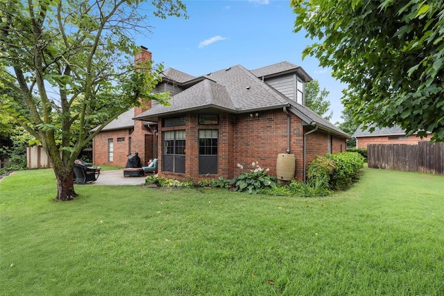4001 Innsbrook Ct, Norman, OK 73072 - back of house with a patio area, a chimney, brick siding, and a shingled roof