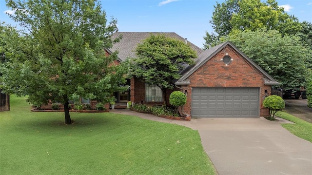 4001 Innsbrook Ct, Norman, OK 73072 - view of front of home with brick siding, driveway, a front lawn, and an attached garage