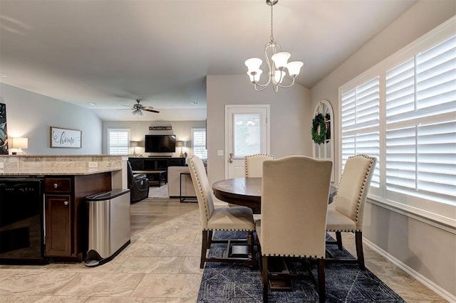 11513 SW 26th St, Yukon, OK 73099 - dining room featuring a chandelier, ceiling fan, and baseboards