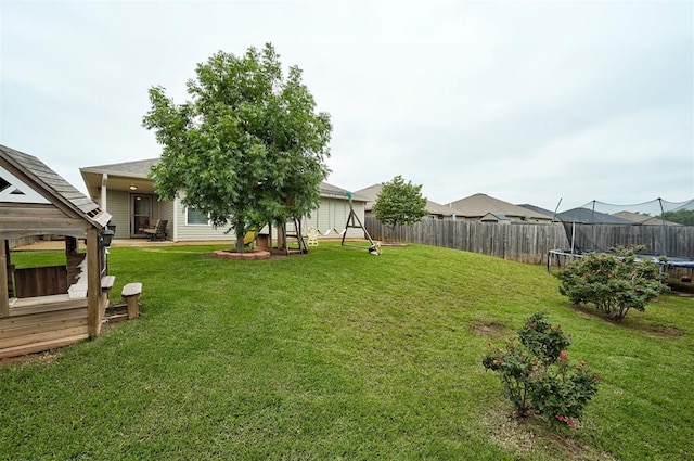 11513 SW 26th St, Yukon, OK 73099 - view of yard with a trampoline