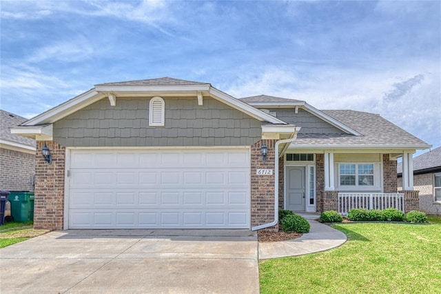 6712 NW 155th St, Edmond, OK 73013 - view of front of home with brick siding, driveway, an attached garage, and a front yard
