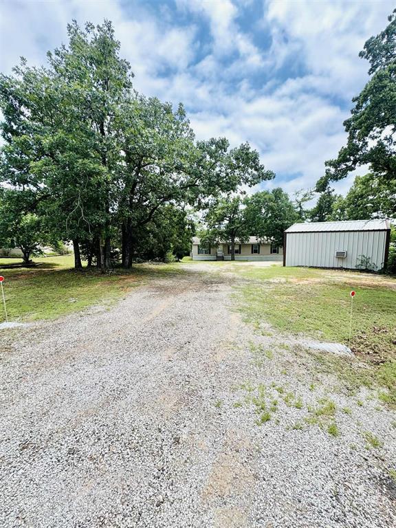 4300 S Rabbit Run, Edmond, OK 73034 - view of green lawn featuring an outbuilding