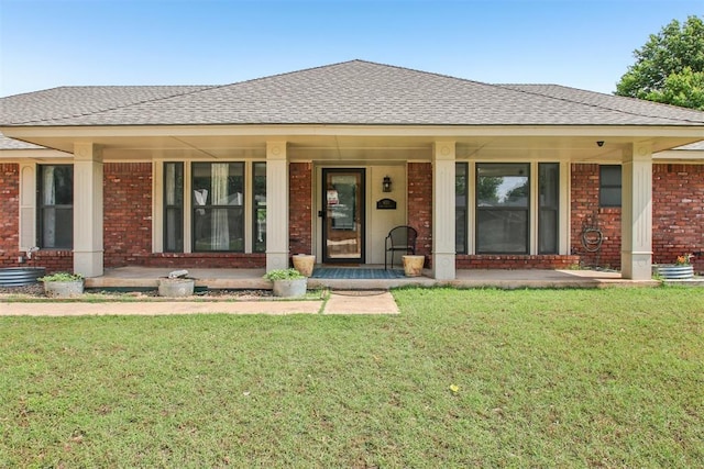 4211 Blue Sage Rd, Norman, OK 73072 - view of front facade with brick siding, covered porch, roof with shingles, and a front yard