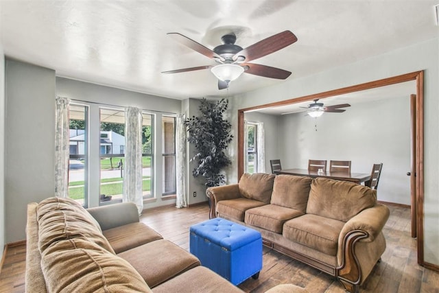 4211 Blue Sage Rd, Norman, OK 73072 - living room featuring ceiling fan, healthy amount of natural light, and baseboards