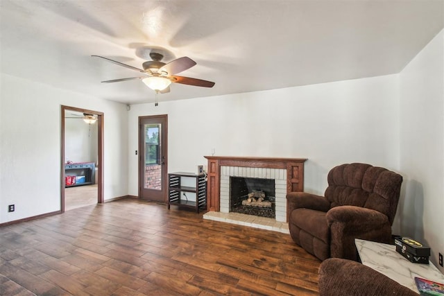4211 Blue Sage Rd, Norman, OK 73072 - living area with ceiling fan, wood finished floors, a brick fireplace, and baseboards