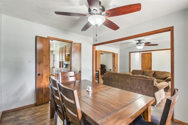 4211 Blue Sage Rd, Norman, OK 73072 - dining room featuring wood finished floors, ceiling fan, and baseboards