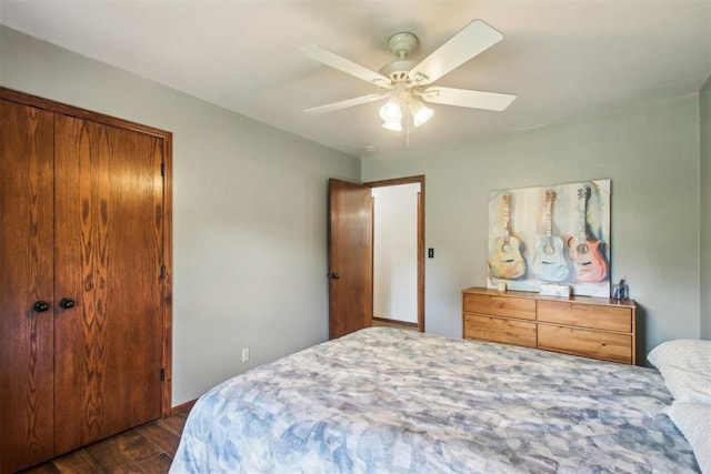 4211 Blue Sage Rd, Norman, OK 73072 - bedroom featuring dark wood-type flooring and ceiling fan