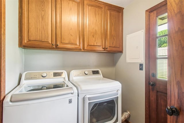 4211 Blue Sage Rd, Norman, OK 73072 - laundry room featuring washer and dryer, electric panel, and cabinet space