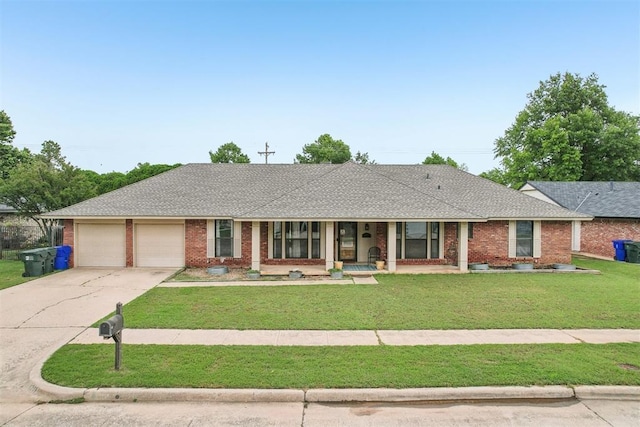 4211 Blue Sage Rd, Norman, OK 73072 - ranch-style house featuring covered porch, a garage, concrete driveway, a front yard, and brick siding