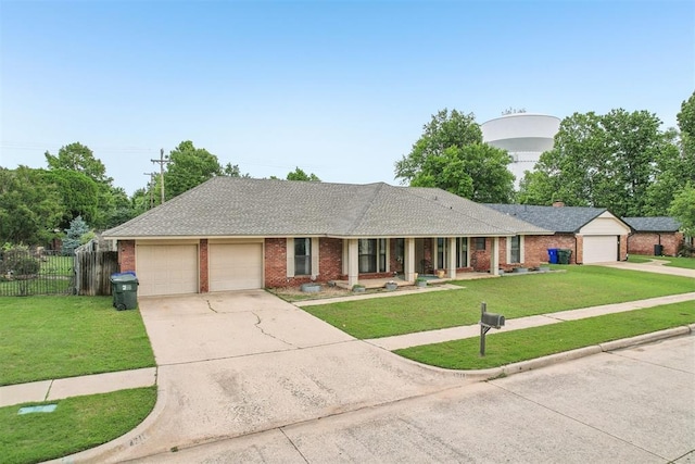 4211 Blue Sage Rd, Norman, OK 73072 - ranch-style home with an attached garage, brick siding, driveway, covered porch, and roof with shingles