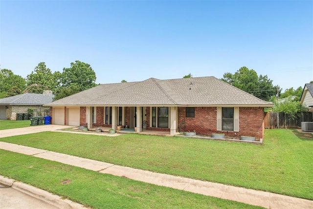 4211 Blue Sage Rd, Norman, OK 73072 - ranch-style home featuring a garage, driveway, brick siding, covered porch, and roof with shingles
