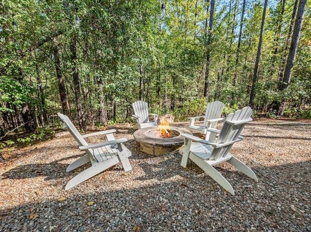 284 Red Berry Trl, Broken Bow, OK 74728 - view of patio / terrace featuring an outdoor fire pit
