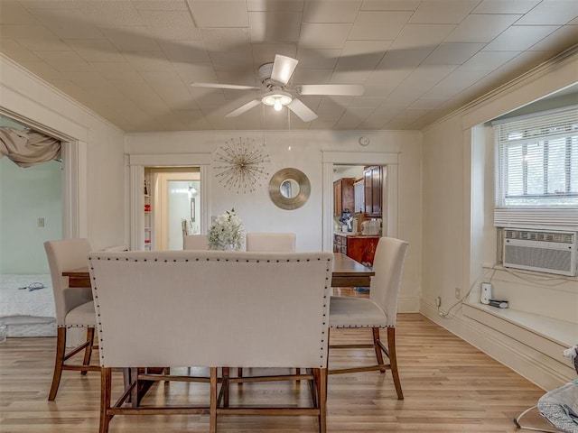 934 N Beard Ave, Shawnee, OK 74801 - dining area with a ceiling fan, light wood-style floors, cooling unit, and ornamental molding