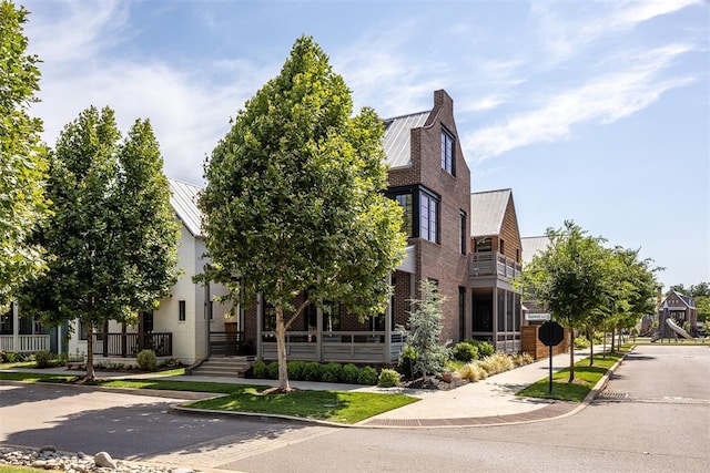 1801 Runway Blvd, Oklahoma City, OK 73108 - view of front of house featuring a metal roof, brick siding, and a standing seam roof