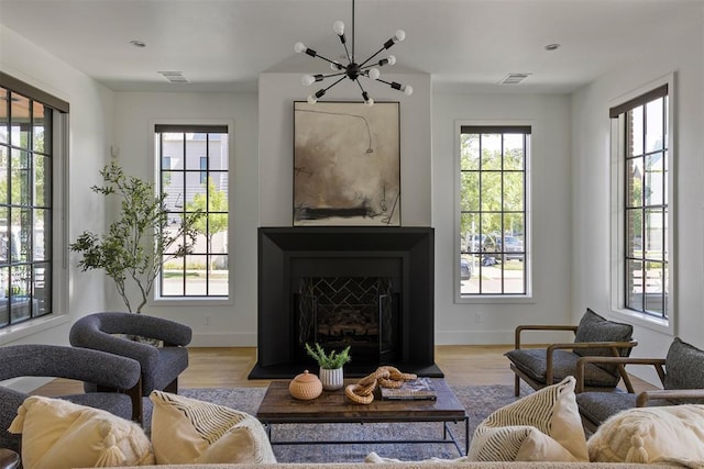 1801 Runway Blvd, Oklahoma City, OK 73108 - living area featuring wood finished floors and a chandelier