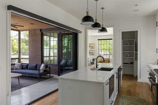 1801 Runway Blvd, Oklahoma City, OK 73108 - kitchen with high end stainless steel range, healthy amount of natural light, and white cabinetry
