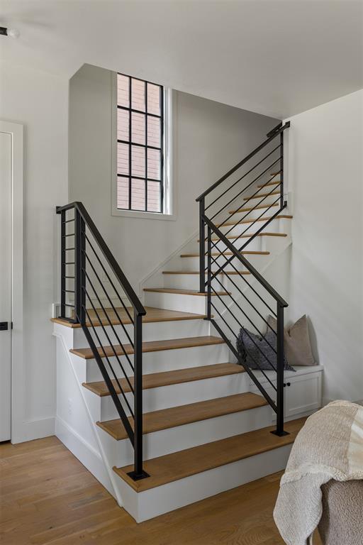 1801 Runway Blvd, Oklahoma City, OK 73108 - stairs featuring wood finished floors and baseboards