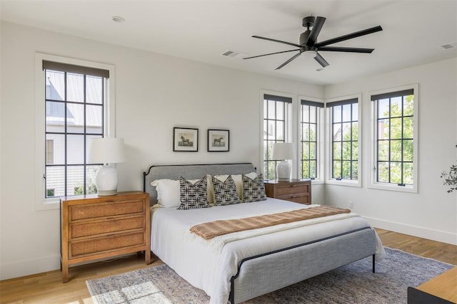 1801 Runway Blvd, Oklahoma City, OK 73108 - bedroom featuring multiple windows, wood finished floors, and a ceiling fan
