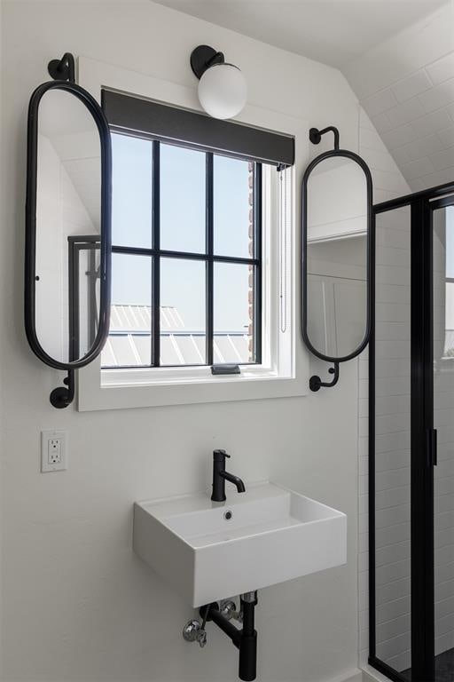 1801 Runway Blvd, Oklahoma City, OK 73108 - bathroom with plenty of natural light, vaulted ceiling, and a stall shower
