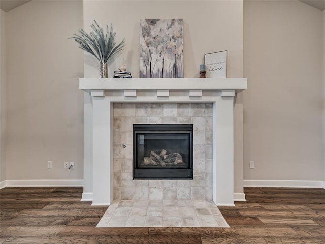 915 Kings Canyon Rd, Norman, OK 73071 - detailed view of wood finished floors, baseboards, and a fireplace