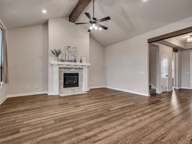 915 Kings Canyon Rd, Norman, OK 73071 - unfurnished living room featuring wood finished floors, a ceiling fan, a tile fireplace, baseboards, and recessed lighting