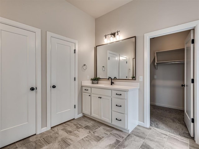 915 Kings Canyon Rd, Norman, OK 73071 - bathroom with vanity and baseboards